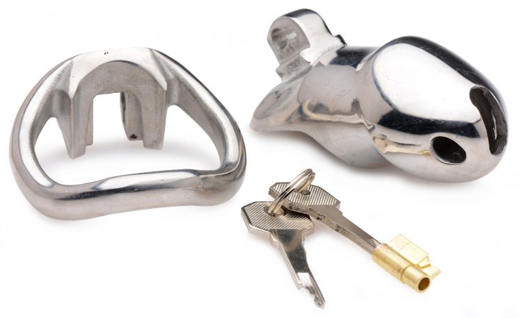 Master Series Rikers 24/7 Steel Locking Male Chastity Cage from XR Brands. Keep your slave confined all day and all night! This chastity device has a uniquely compact design, with an internal locking system that prevents a bulky appearance under clothing. Insert the key into the brass keyhole and turn to straighten out the lock. The lock can then be inserted into or removed from the hinge. With another twist of the key, your slave will be helplessly trapped until you decide to show mercy! Great for sissification, cuckolding and slaves. Made of stainless steel, this cage is non-porous and phthalate free. Measurements base ring is 2 inches in diameter. Shaft is 3.25 inches in length and 1.3 inches in diameter. Materials Stainless steel cage, brass lock set. Color Silver. Note includes internal lock and two keys. Categories: Bondage, Fetish, Kink, Men's Fetish Wear, Men's Cock and Ball Gear.