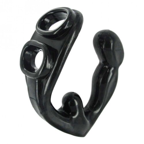 The Rouge is a uniquely designed piece that fits tightly over the cock and balls with a perineum stimulator as well with a bulbous anal plug. A built-in compartment designed for a vibrating bullet is located in the base so the wearer can be pushed over the edge with vibration. Measurements: Anal Plug has 4.5 inch insertable length, 1.48 max insertable width. Cock Ring has 1.42 inch internal width. Ball Ring has 1.3 inch internal width. Accommodated bullet vibes up to 0.5 inches in diameter. Material: TPR Color: Black Note: Vibrating bullet not included.